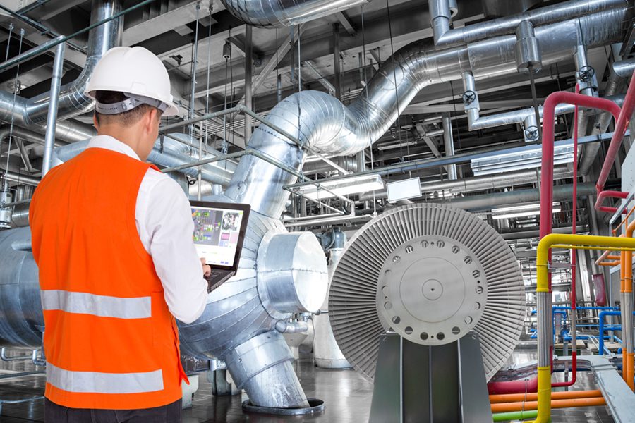 power plant interior with maintenance engineer